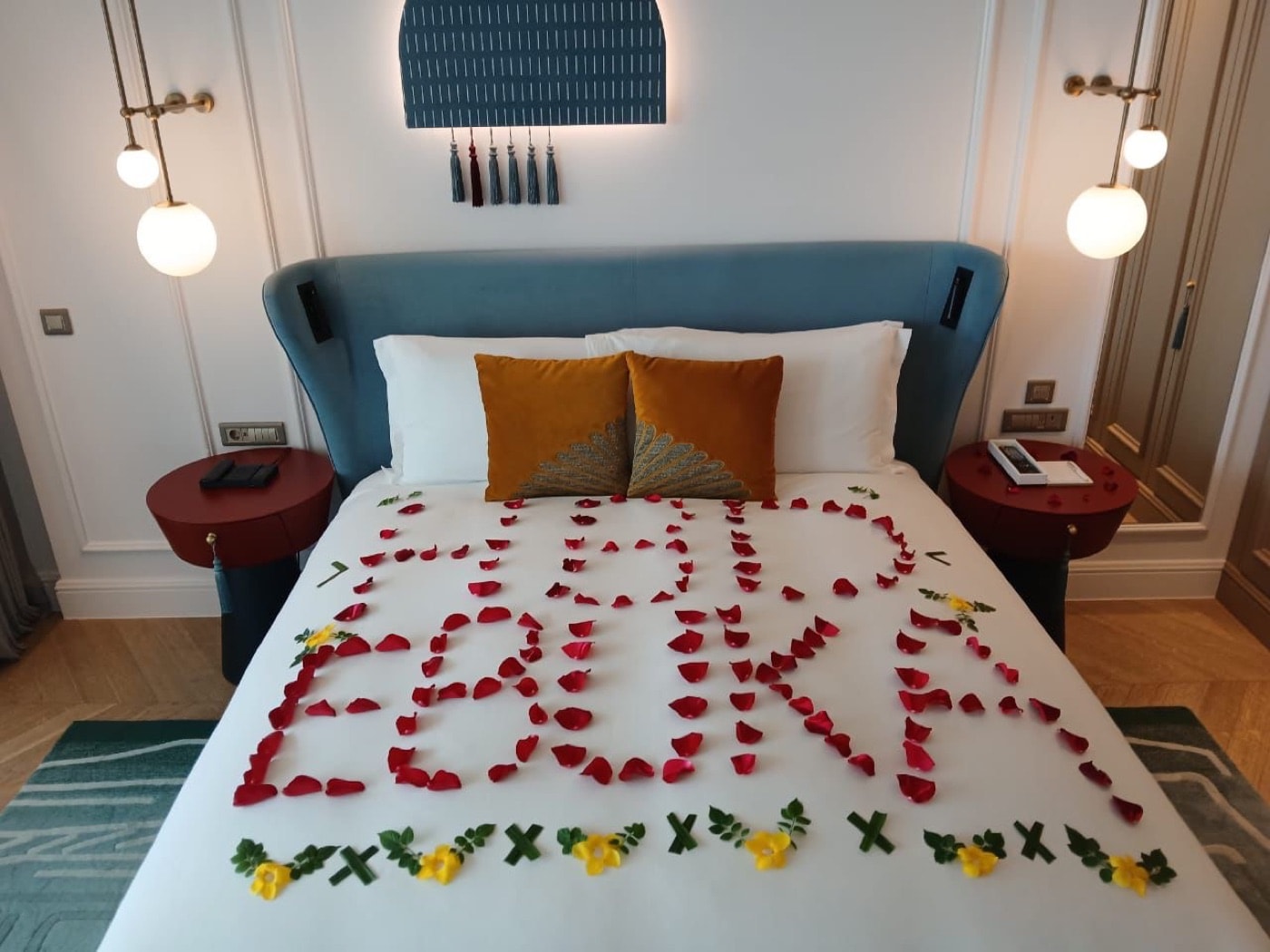 A suite dressed with rose petals for a birthday